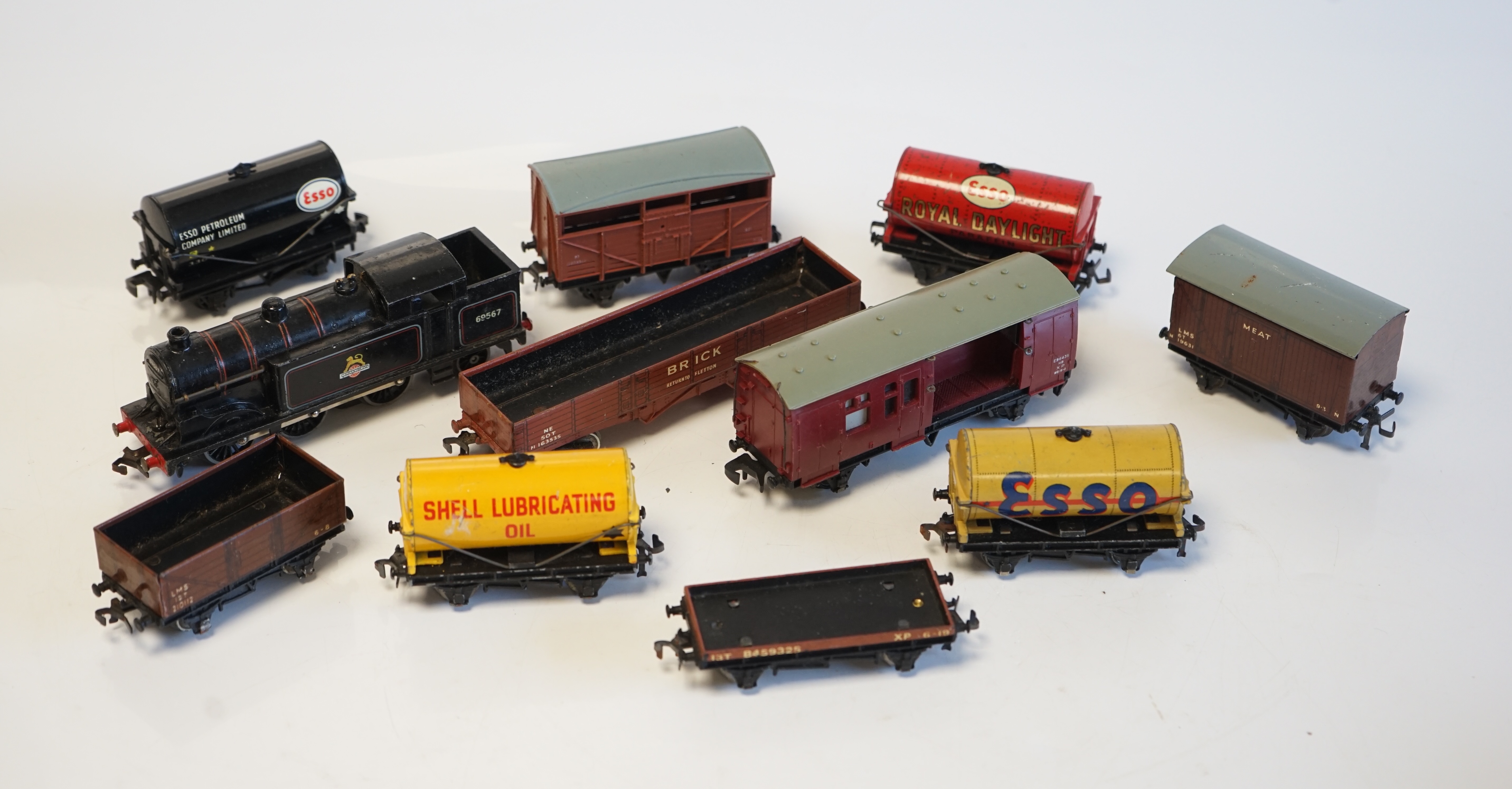 A quantity of Hornby Dublo model railway for 3-rail running including; a BR Class N2 0-6-2T locomotive, eight tinplate bogie coaches, 25 freight wagons, two track sections for the Royal Mail TPO set, and a large quantity